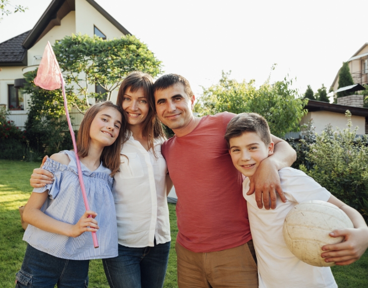 smiling family outdoors